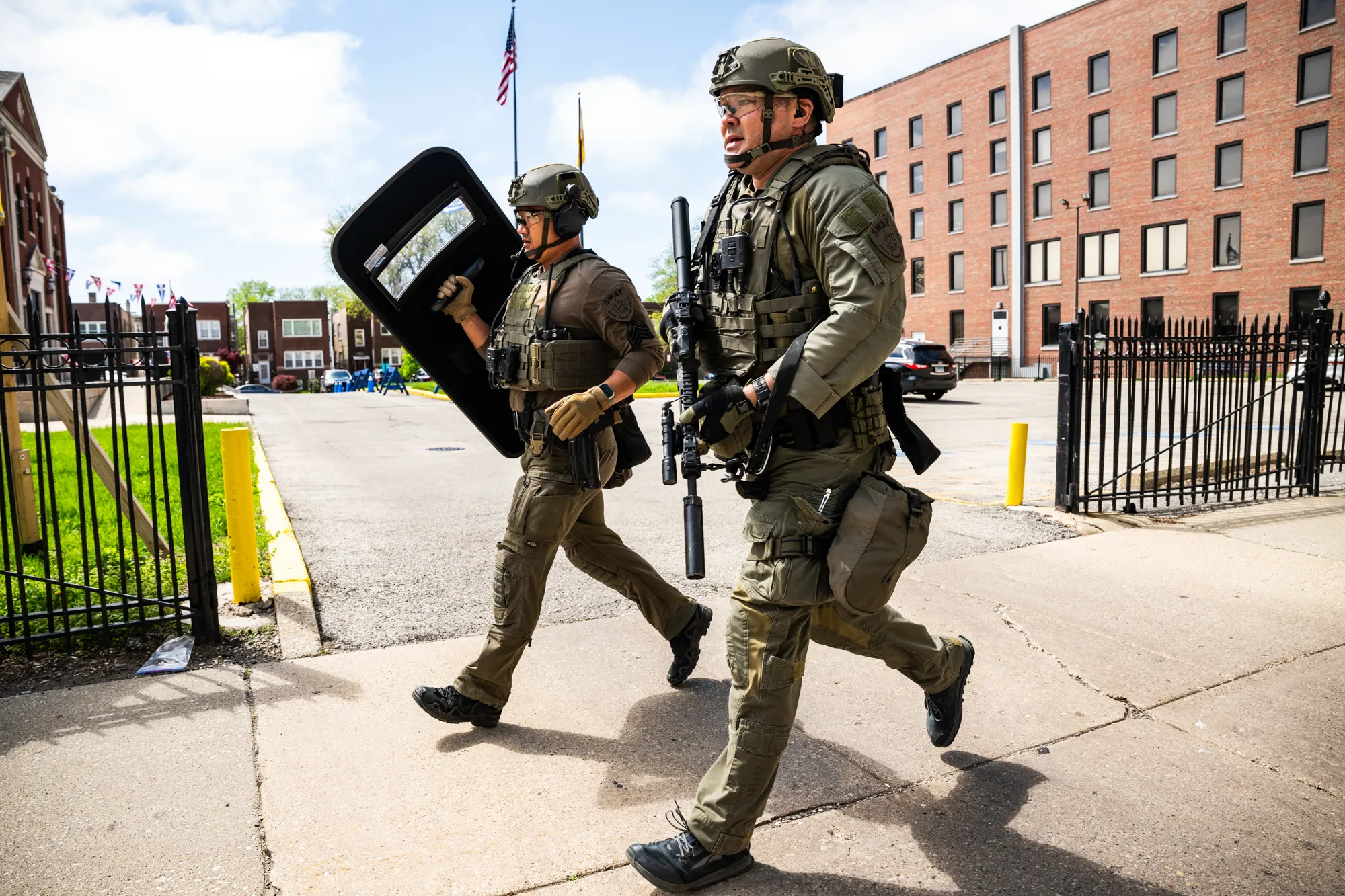 This Week In Photos: Police Officer Killed In Hospital Shooting, Red Line Extension Begins